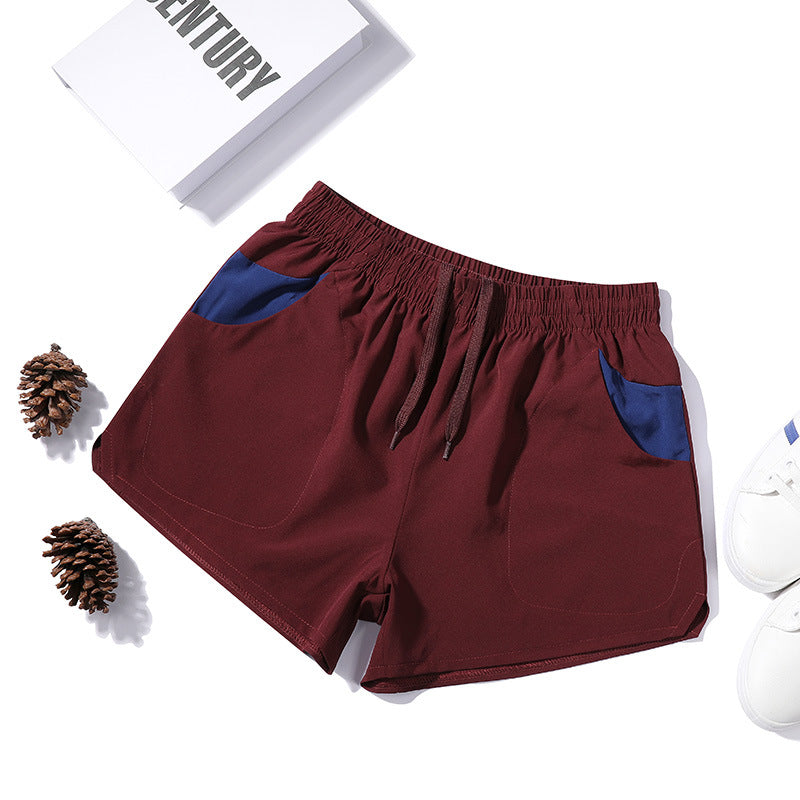 Shorts de fitness extensibles trois-quarts pour homme