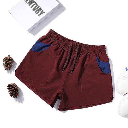 Pantalones cortos de fitness elásticos de tres cuartos para hombre