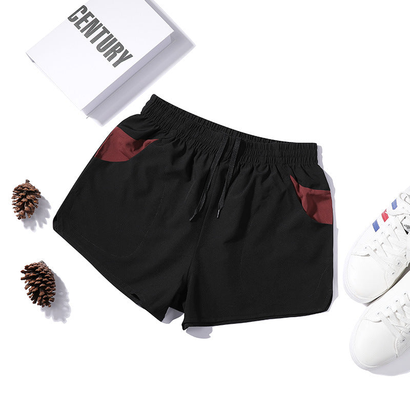 Shorts de fitness extensibles trois-quarts pour homme