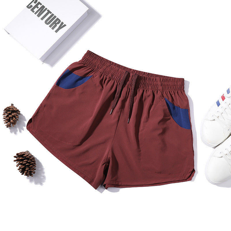 Shorts de fitness extensibles trois-quarts pour homme