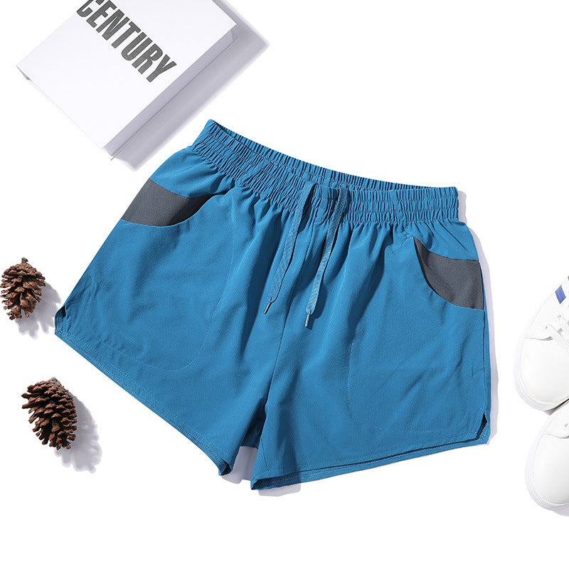 Shorts de fitness extensibles trois-quarts pour homme