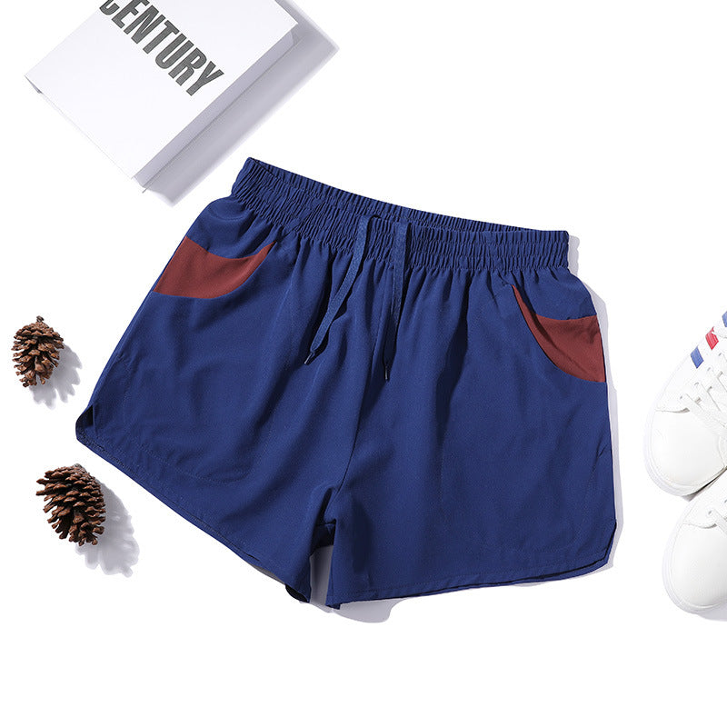 Shorts de fitness extensibles trois-quarts pour homme