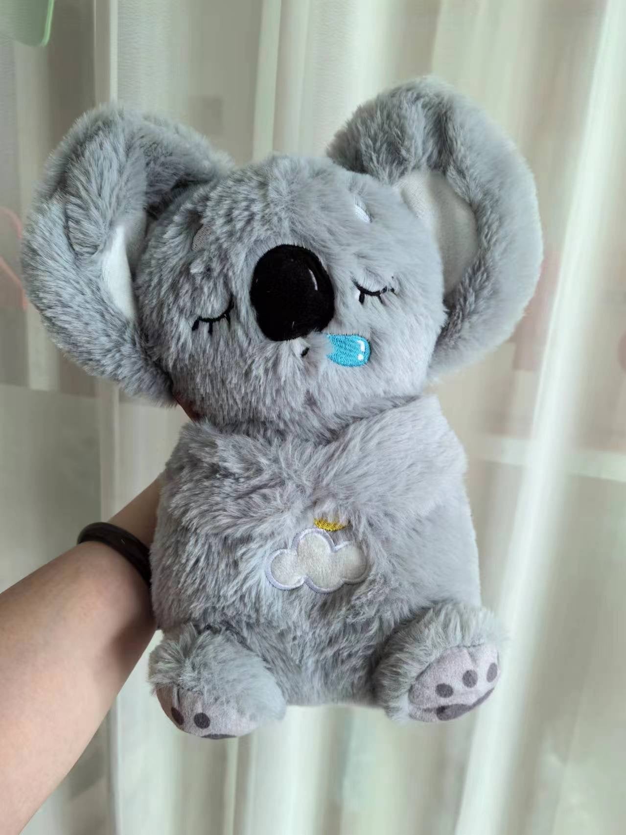 Máquina de sonido Lontra Acurrúcate y Tranquiliza Juguete de peluche portátil para bebé con detalles sensoriales música luces y movimiento rítmico de respiración