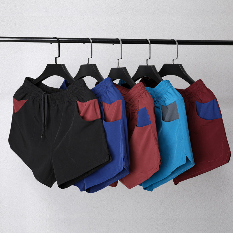 Shorts de fitness extensibles trois-quarts pour homme